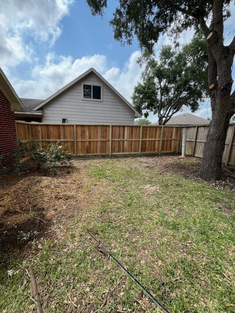 fresh-wood-fence-in-backyard